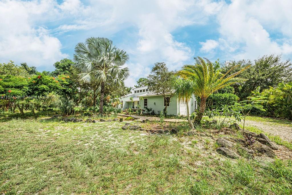 4882 Southeast Bayshore Terrace Stuart, FL 34997 - Photo 14 of 56 a view of a yard in front of the house