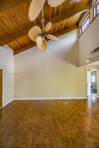 a view of a chairs and table in the room