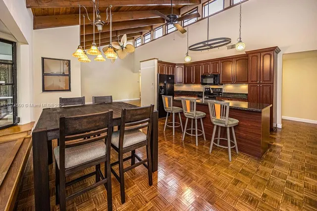 a view of a refrigerator with wooden floor