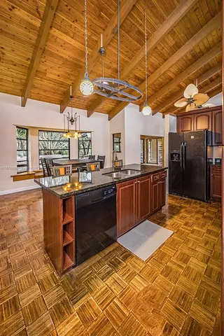 a kitchen with stainless steel appliances granite countertop a sink and a counter