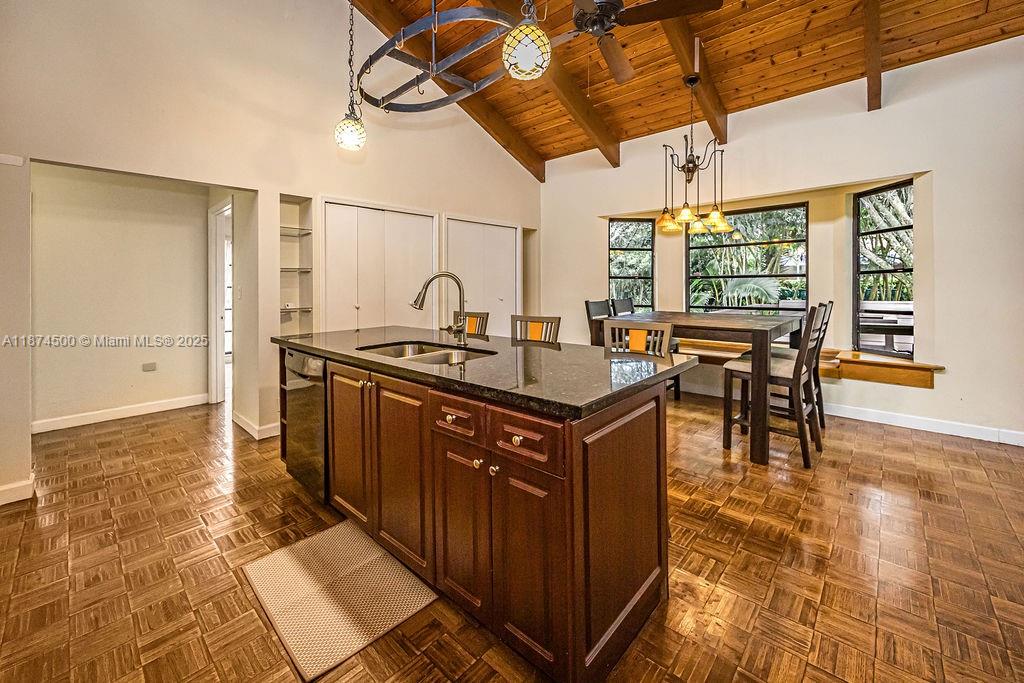 4882 Southeast Bayshore Terrace Stuart, FL 34997 - Photo 30 of 56 a kitchen with stainless steel appliances granite countertop a sink and a counter