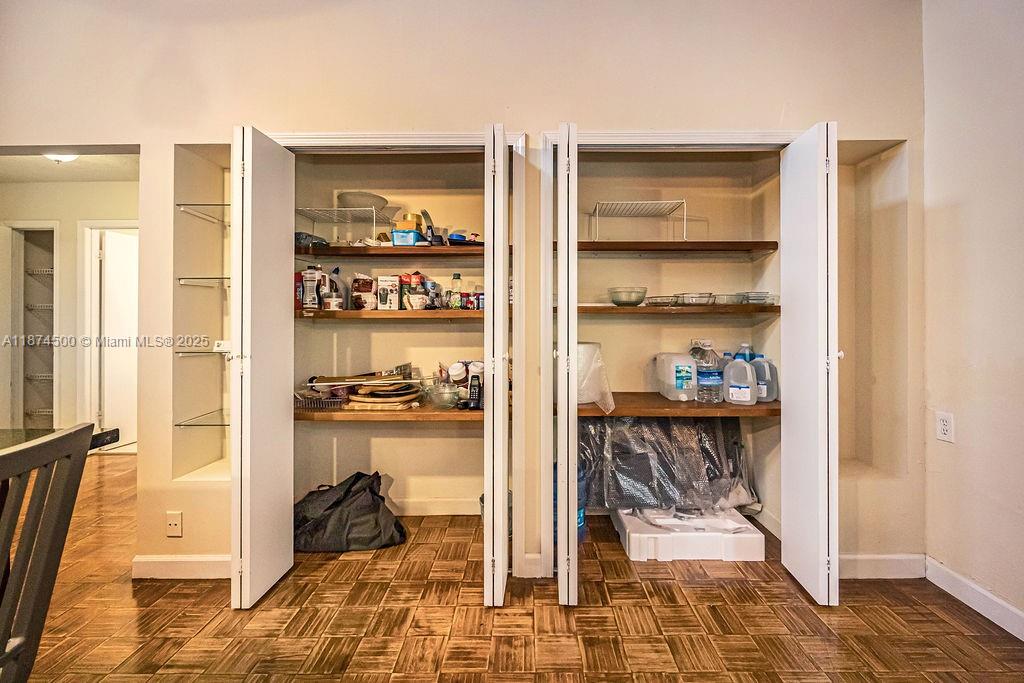 4882 Southeast Bayshore Terrace Stuart, FL 34997 - Photo 31 of 56 a view of a livingroom with wooden floor and a rug