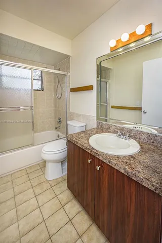 a view of an empty room with a bathroom