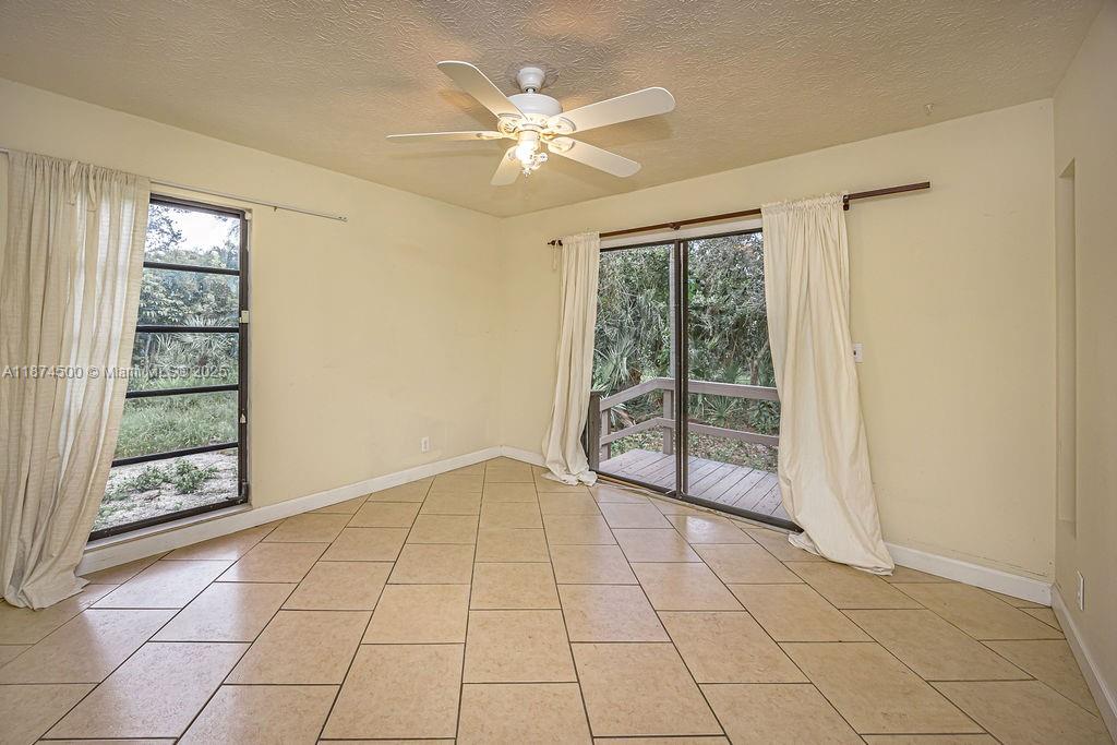 4882 Southeast Bayshore Terrace Stuart, FL 34997 - Photo 46 of 56 a view of an empty room with a window