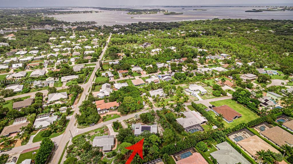 4882 Southeast Bayshore Terrace Stuart, FL 34997 - Photo 56 of 56 an aerial view of residential houses with outdoor space