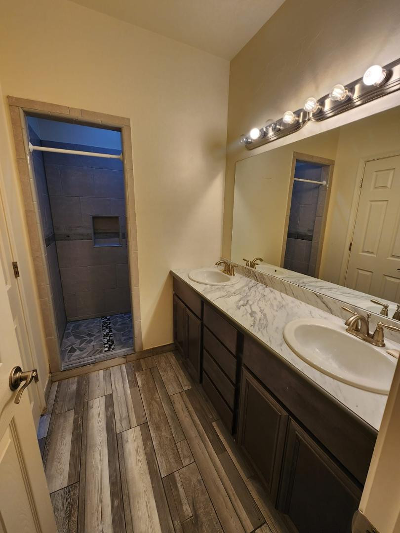 3641 Camino Del Rancho Douglas, AZ 85607 - Photo 15 of 20 a bathroom with a sink a toilet a mirror and shower