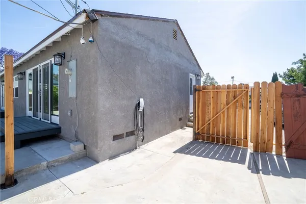 a view of balcony with wooden floor and fence