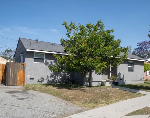 a view of a house with a yard and garage