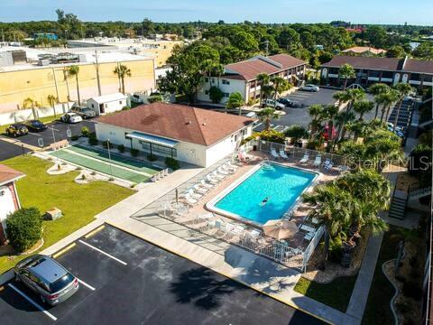 1531 Placida Road, Unit 203 Englewood, FL 34223 - Photo 3 of 28 a view of a swimming pool with an outdoor seating and a yard