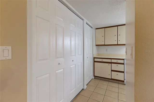 a view of cabinets and window