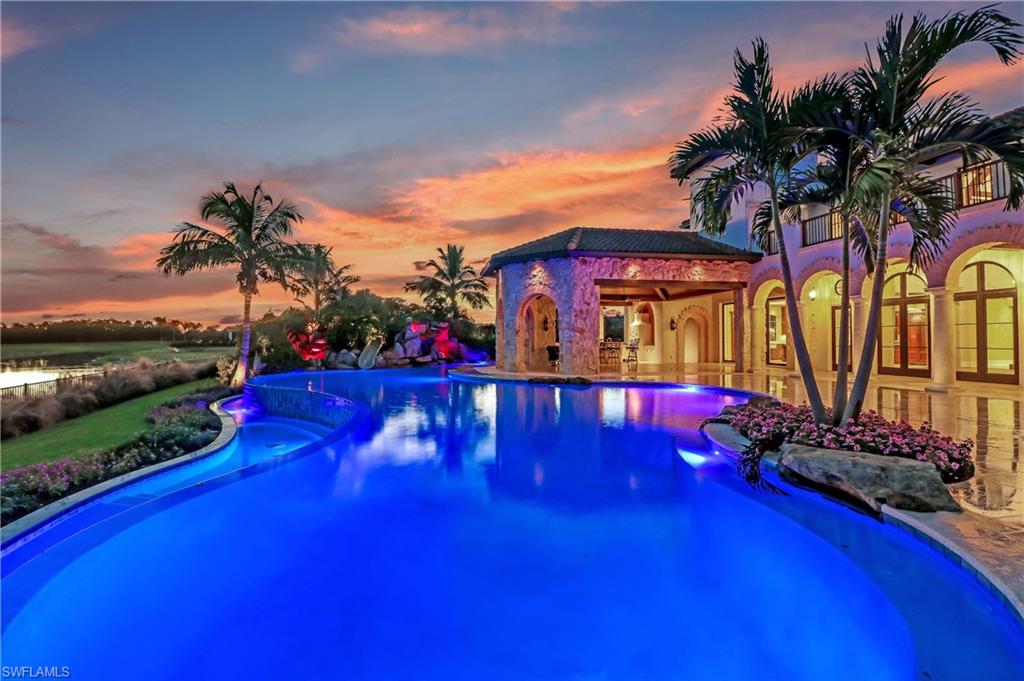 16622 Firenze Way Naples, FL 34110 - Photo 17 of 35 a view of swimming pool with outdoor seating