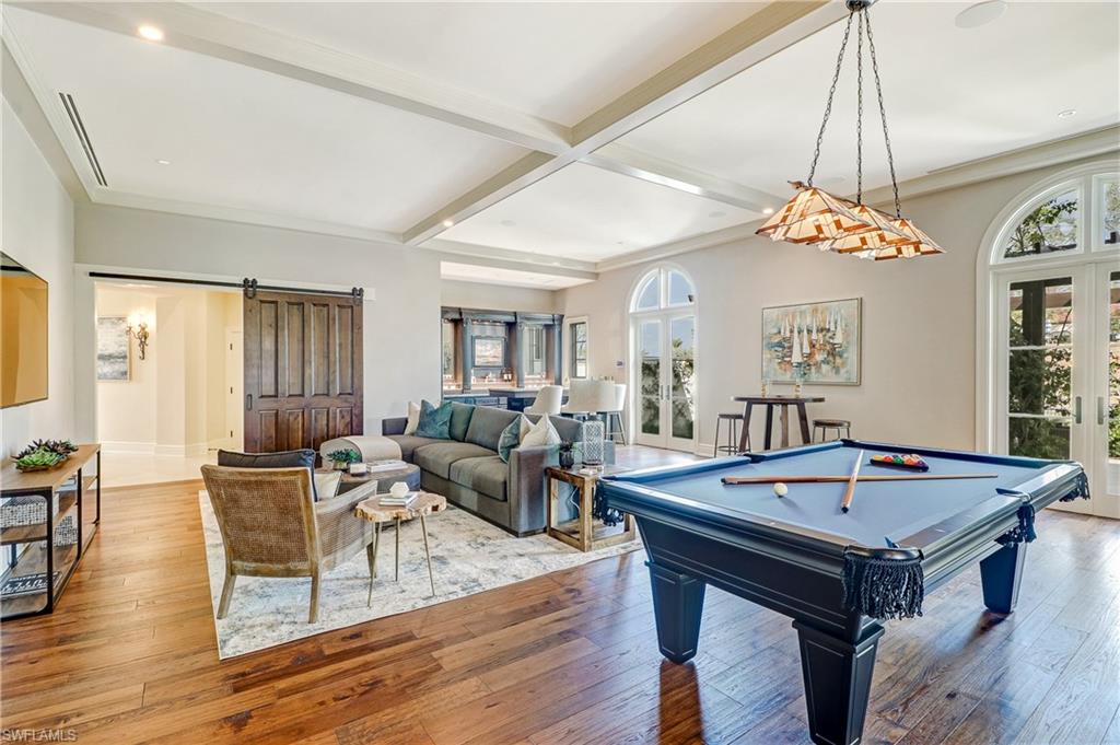 16622 Firenze Way Naples, FL 34110 - Photo 19 of 35 a view of a dining room with furniture window and wooden floor
