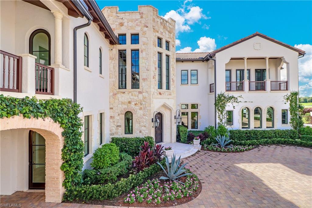 16622 Firenze Way Naples, FL 34110 - Photo 28 of 35 a front view of a multi story residential apartment building