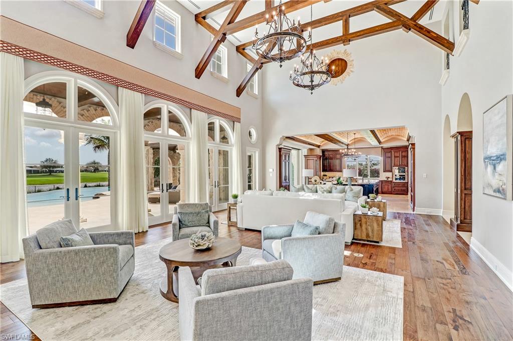 16622 Firenze Way Naples, FL 34110 - Photo 3 of 35 a living room with furniture and a large window