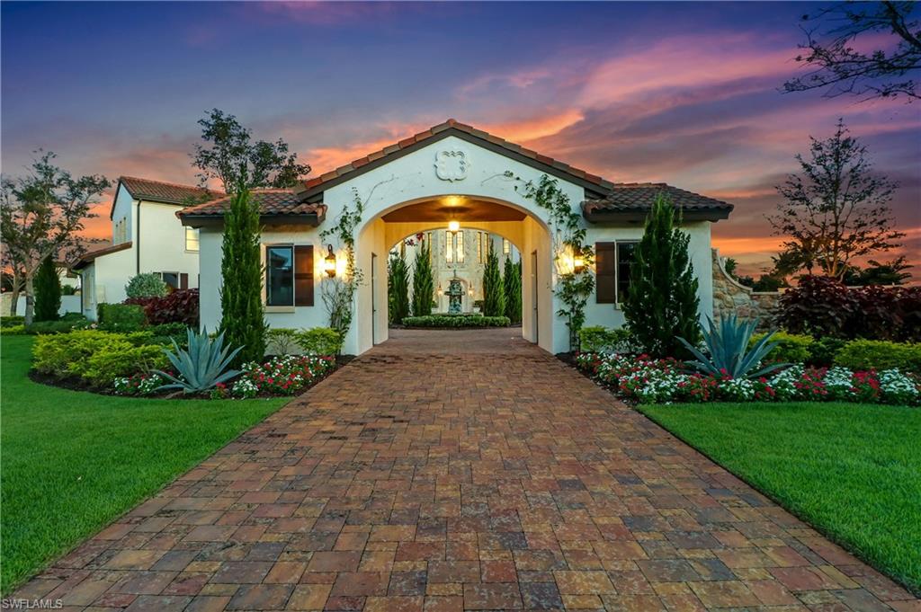 16622 Firenze Way Naples, FL 34110 - Photo 32 of 35 a front view of a house with a yard
