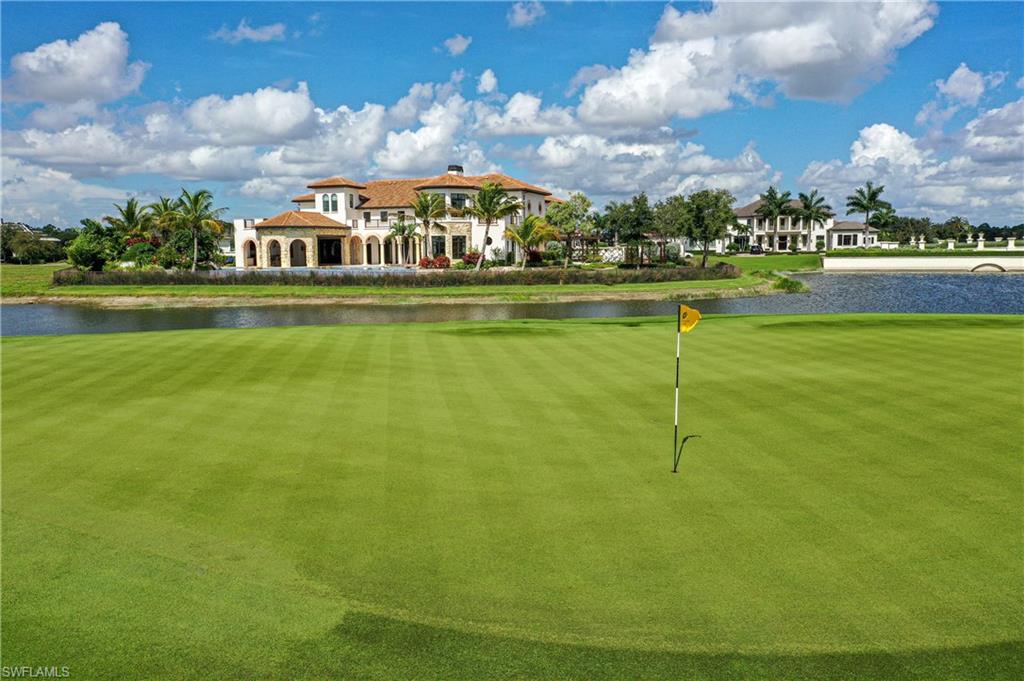 16622 Firenze Way Naples, FL 34110 - Photo 35 of 35 a view of swimming pool with outdoor seating and yard in back