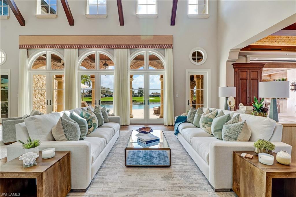 16622 Firenze Way Naples, FL 34110 - Photo 4 of 35 a living room with furniture and a large window