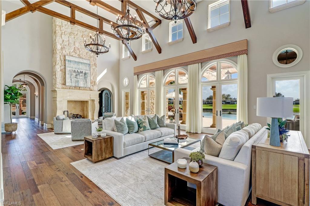 16622 Firenze Way Naples, FL 34110 - Photo 5 of 35 a living room with furniture and wooden floor