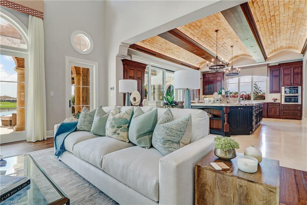 16622 Firenze Way Naples, FL 34110 - Photo 6 of 35 a living room with furniture and a large window