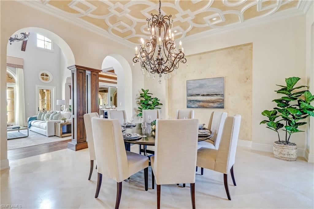 16622 Firenze Way Naples, FL 34110 - Photo 7 of 35 a view of a dining room with furniture window and wooden floor