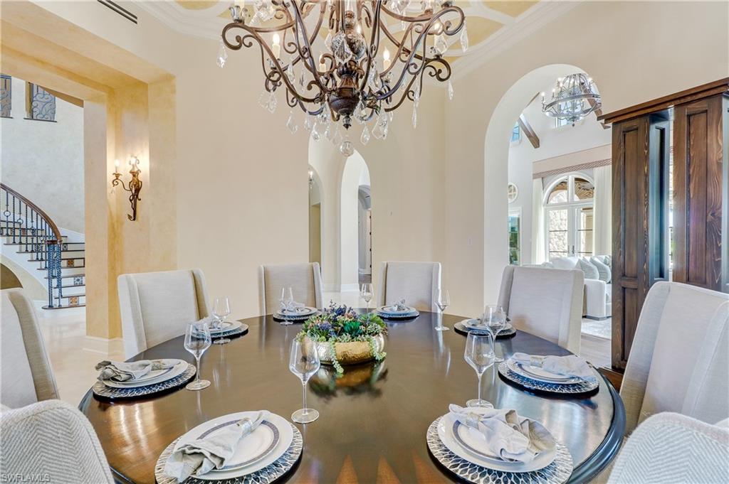 16622 Firenze Way Naples, FL 34110 - Photo 8 of 35 a living room with furniture and a fireplace