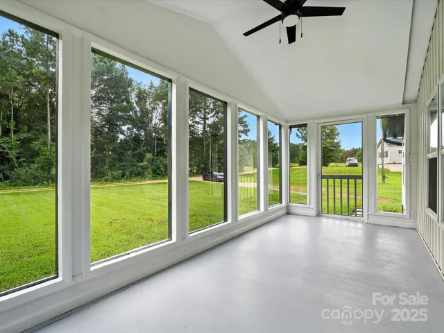 a view of an empty room with a large window