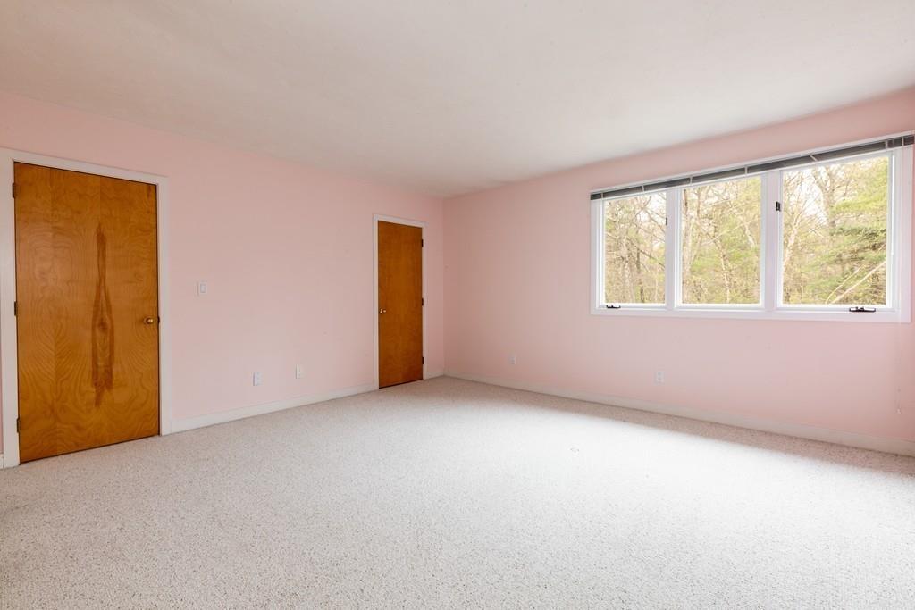 210 Elizabeth Ridge Road Carlisle, MA 01741 - Photo 17 of 25 an empty room with a window