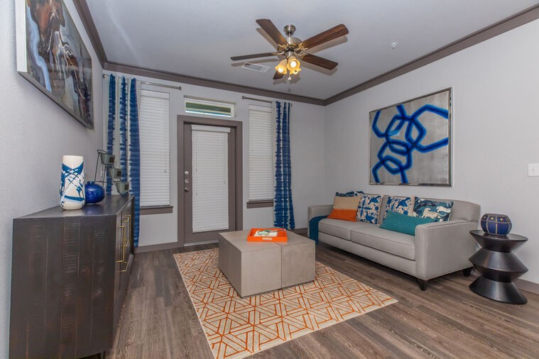 9393 Fm 1960 Bypass Road West, Unit 9201 Humble, TX 77338 - Photo 2 of 28 a living room with furniture and wooden floor