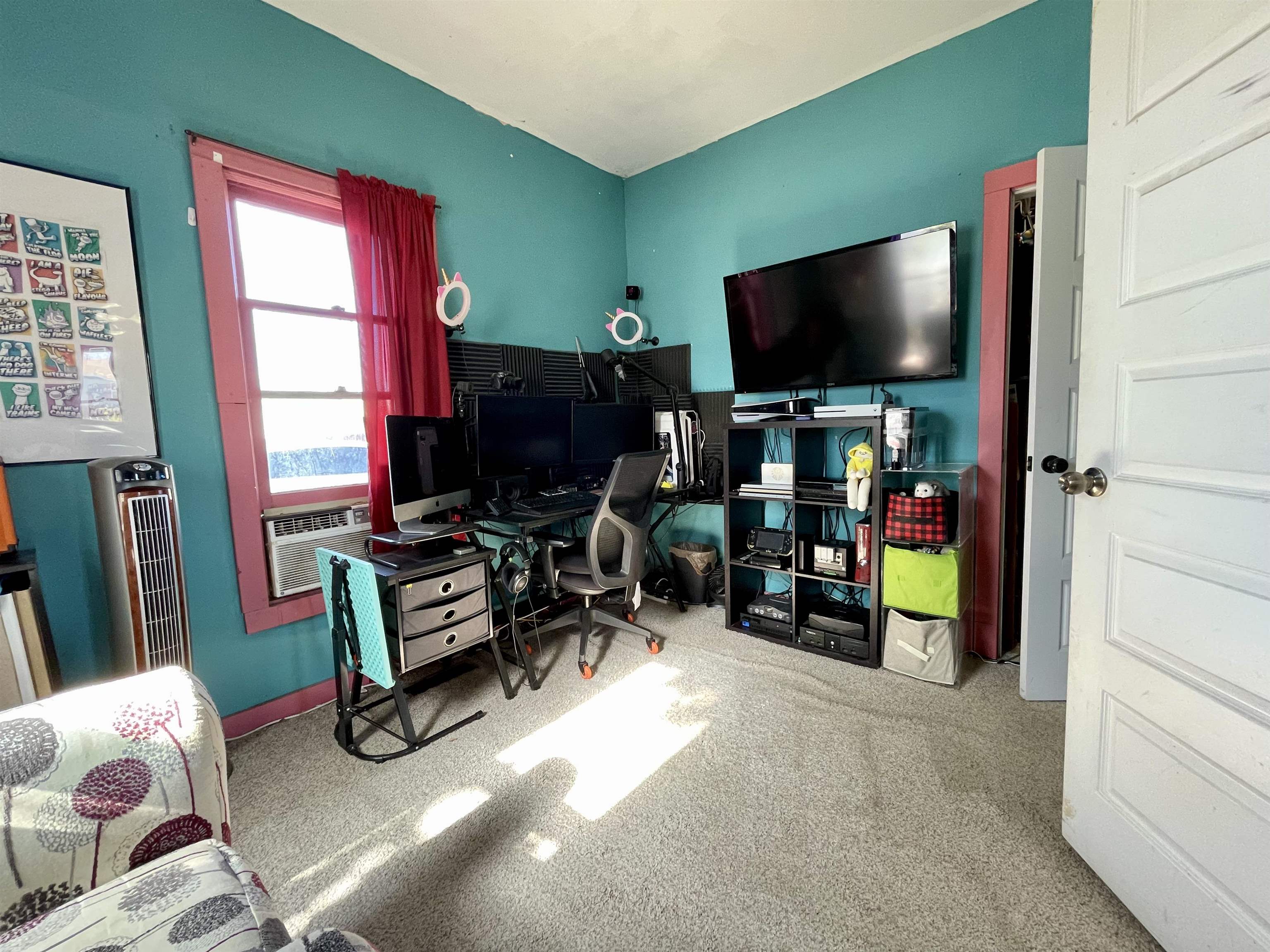 3246 D D 1/2 Road Clifton, CO 81520 - Photo 12 of 17 a room with furniture and a flat screen tv