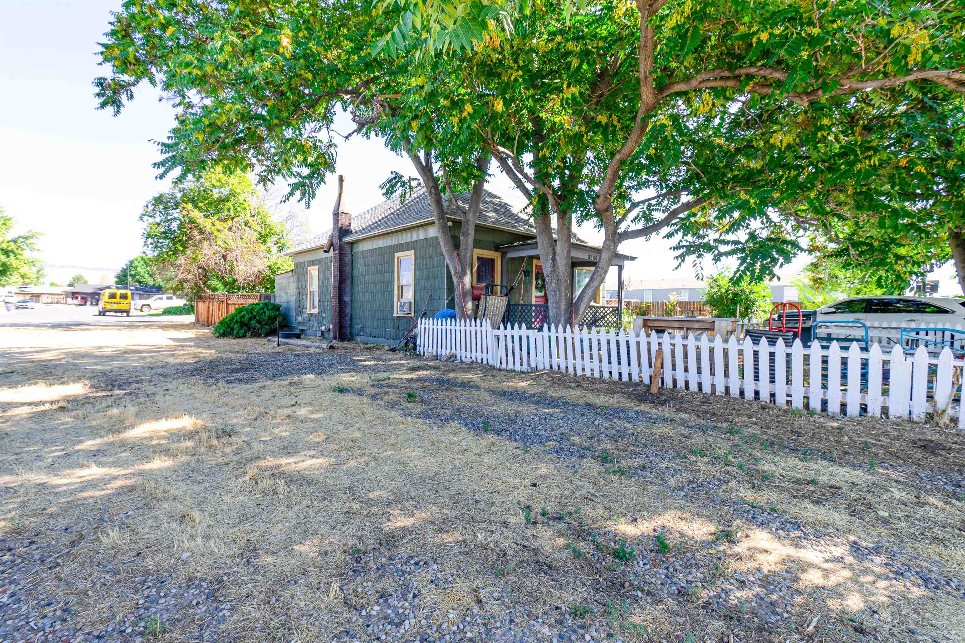 3246 D D 1/2 Road Clifton, CO 81520 - Photo 14 of 17 a front view of a house with tree s