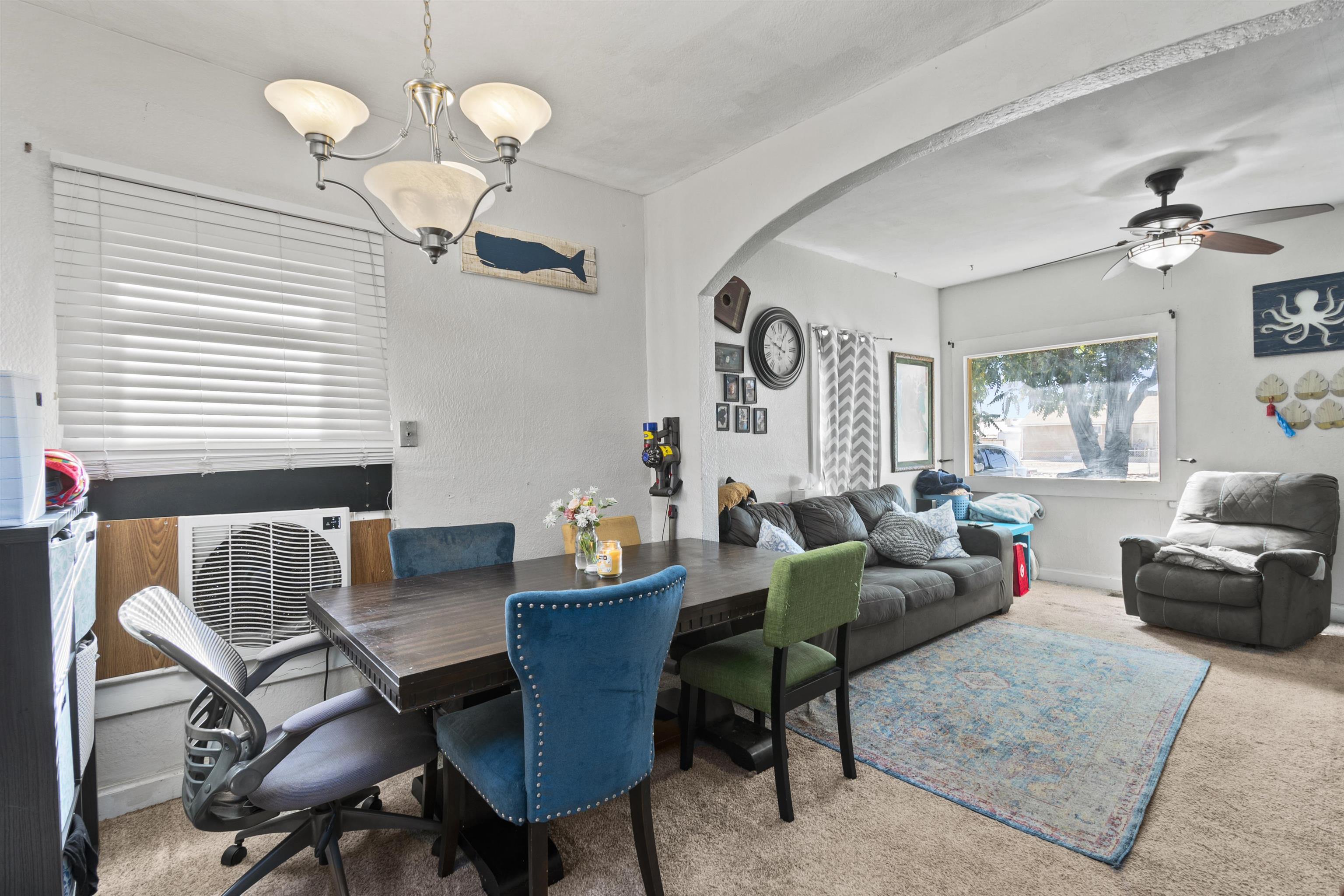 3246 D D 1/2 Road Clifton, CO 81520 - Photo 3 of 17 a living room with furniture a chandelier and a window