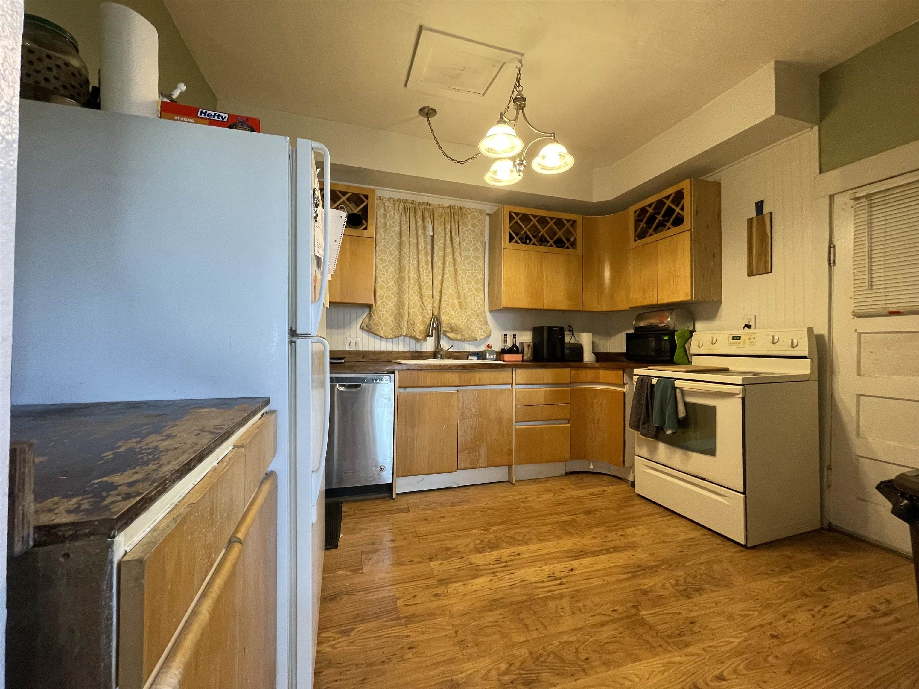 3246 D D 1/2 Road Clifton, CO 81520 - Photo 5 of 17 a kitchen with granite countertop a stove top oven and cabinets