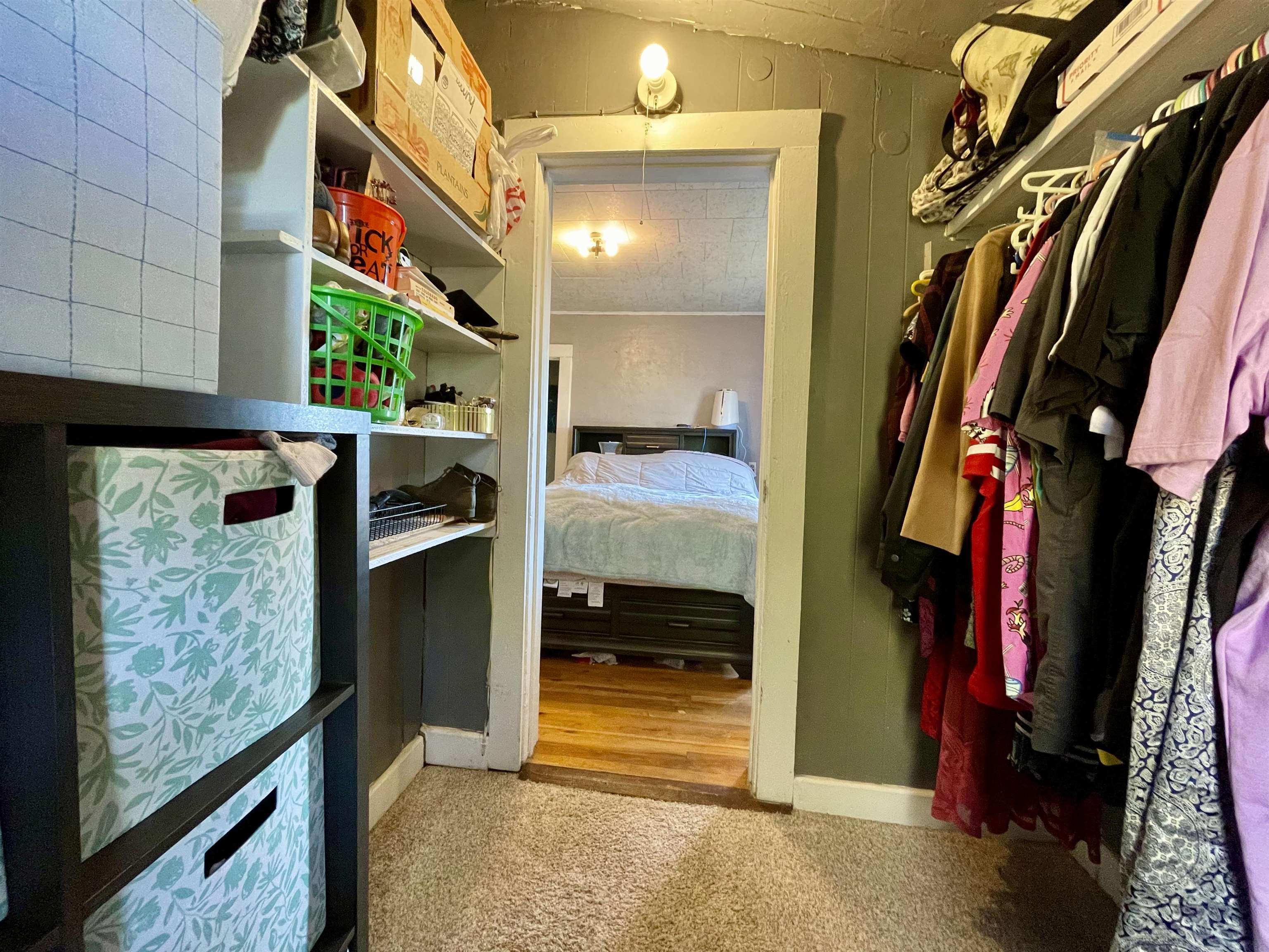 3246 D D 1/2 Road Clifton, CO 81520 - Photo 6 of 17 a view of walk in closet with clothes and shoes
