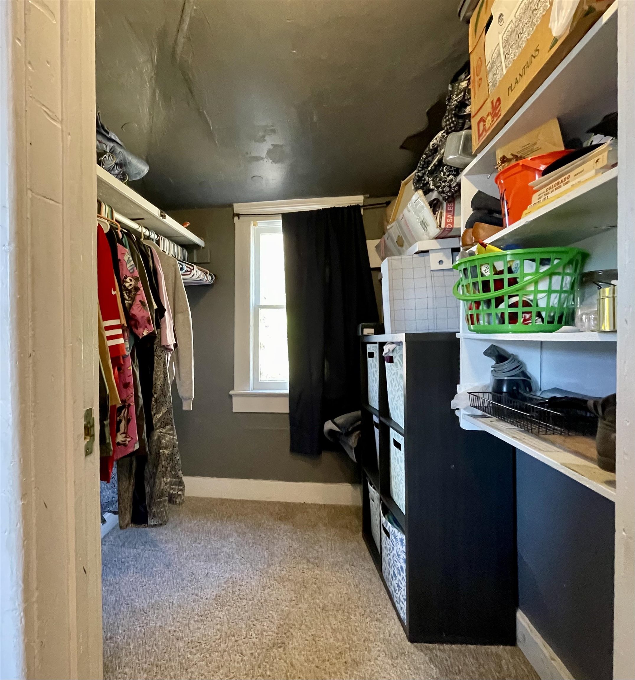 3246 D D 1/2 Road Clifton, CO 81520 - Photo 7 of 17 a view of walk in closet with clothes and shoes