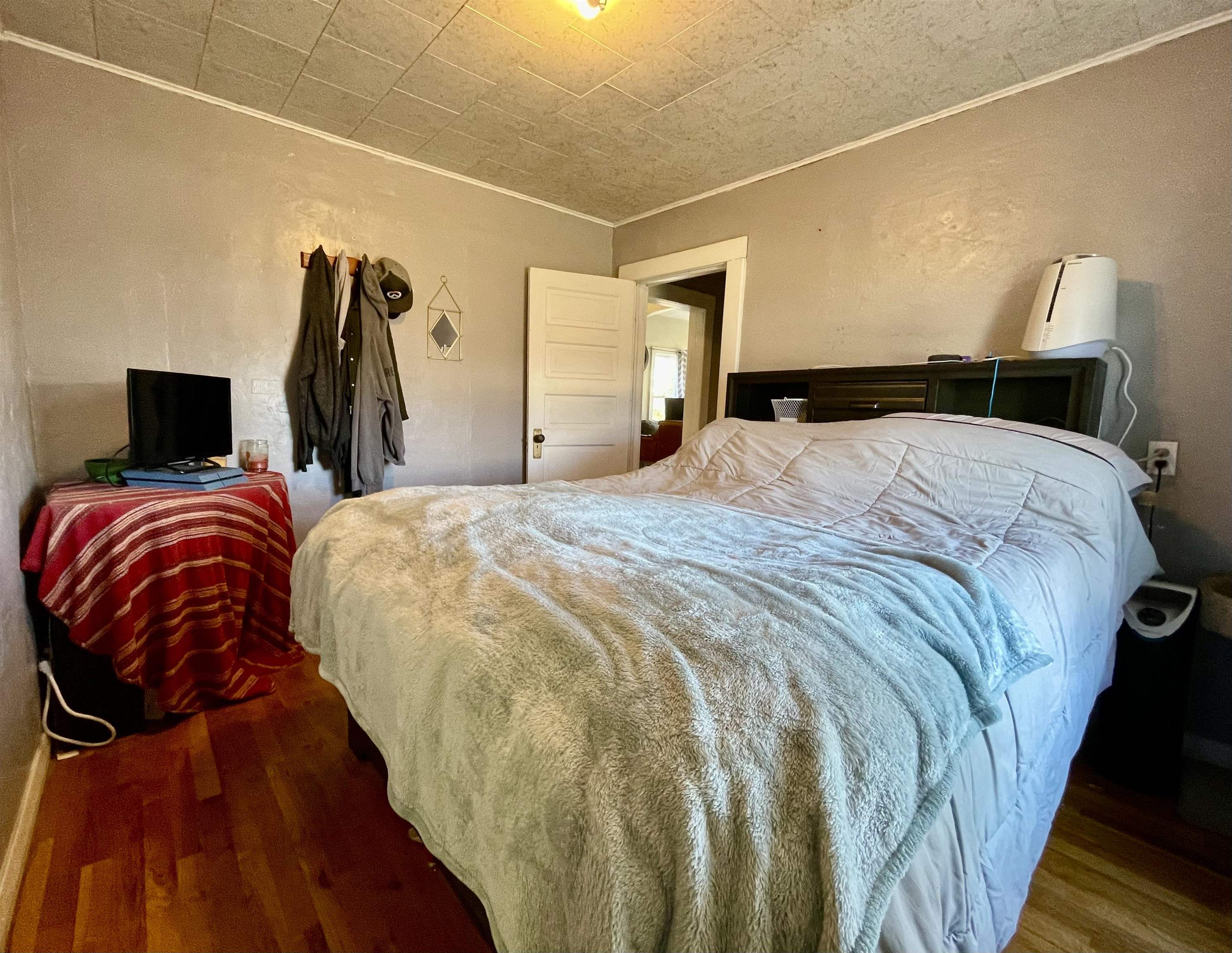 3246 D D 1/2 Road Clifton, CO 81520 - Photo 8 of 17 a bedroom with a bed and a mirror