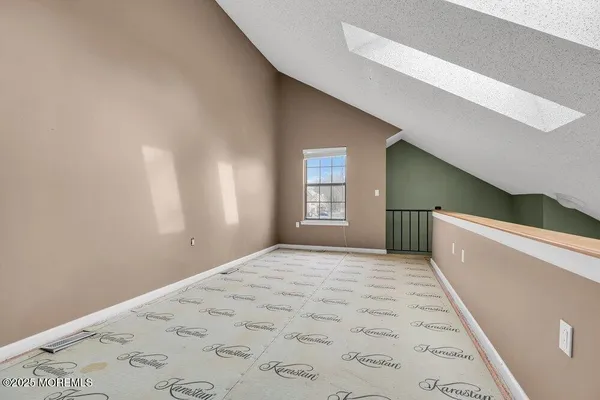 a view of a big room with windows and closet