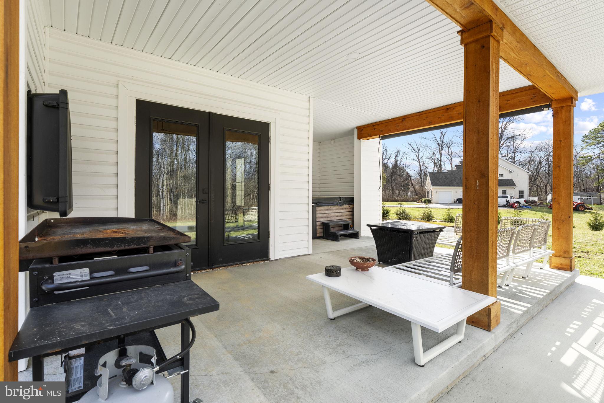97 Otter Point Road Elkton, MD 21921 - Photo 59 of 64 a living room with furniture a window and a flat screen tv
