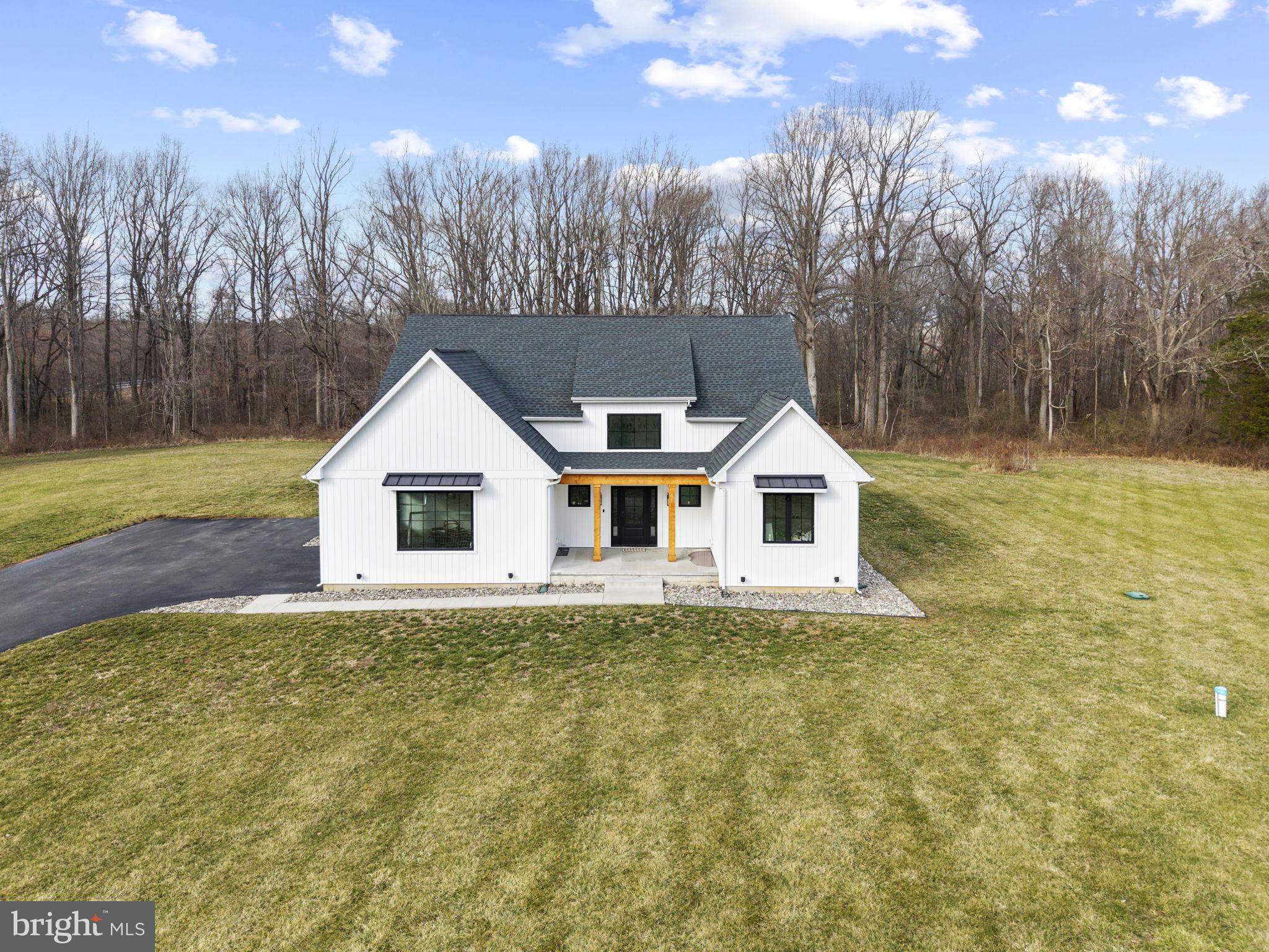 97 Otter Point Road Elkton, MD 21921 - Photo 61 of 64 a house with trees in the background