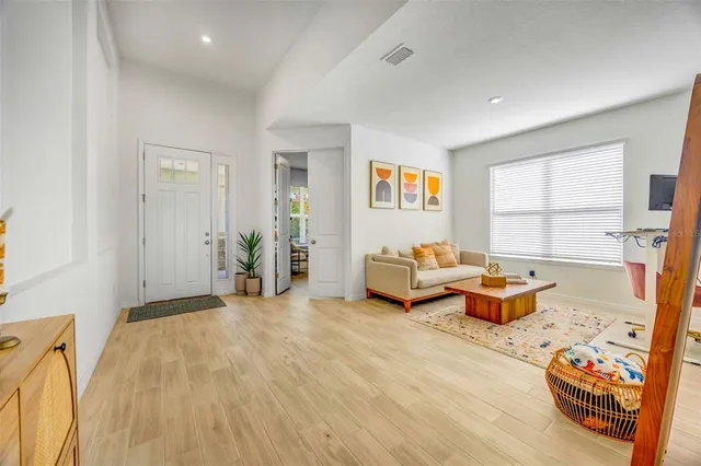 a living room with furniture and a table
