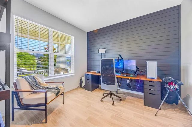 a bedroom with furniture and a book shelf