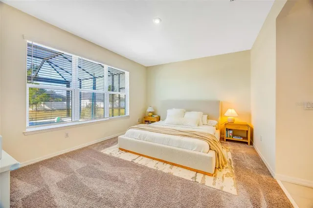 a bathroom with a tub a sink shower and mirror