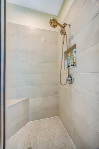 a living room with furniture and a dining table with kitchen view