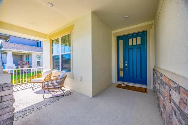 a view of two chairs in the balcony