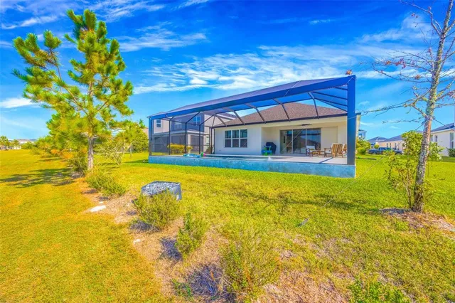 an aerial view of a house with a swimming pool