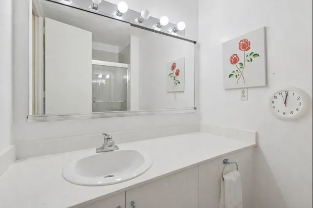 a bathroom with a sink and a mirror