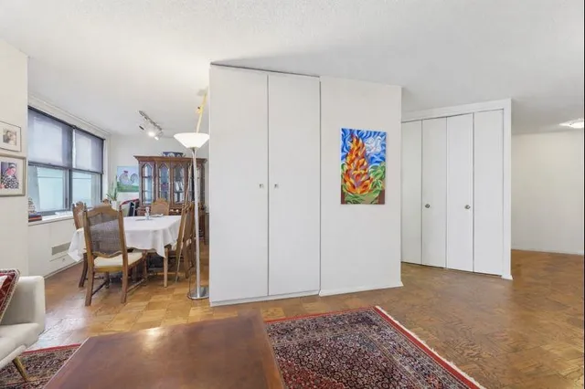 a living room with furniture and a rug