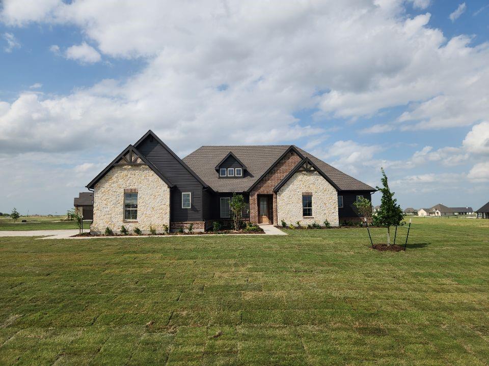 2305 Gypsum Street Krum, TX 76249 - Photo 1 of 22 Stone and brick facade with dark siding accents