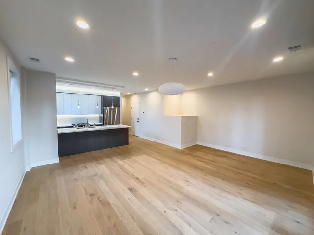 a view of kitchen with wooden floor