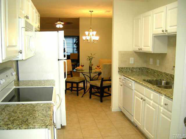 11321 Clubhaven Place Raleigh, NC 27617 - Photo 2 of 10 a bathroom with a tub sink and mirror