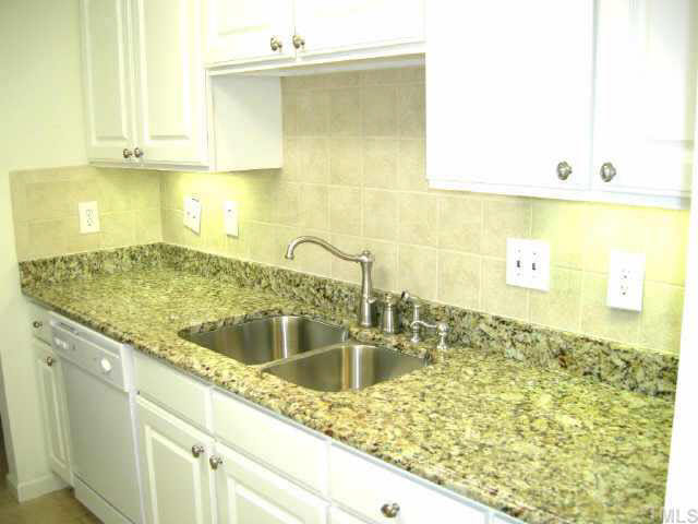11321 Clubhaven Place Raleigh, NC 27617 - Photo 4 of 10 a kitchen with sink and granite counter tops